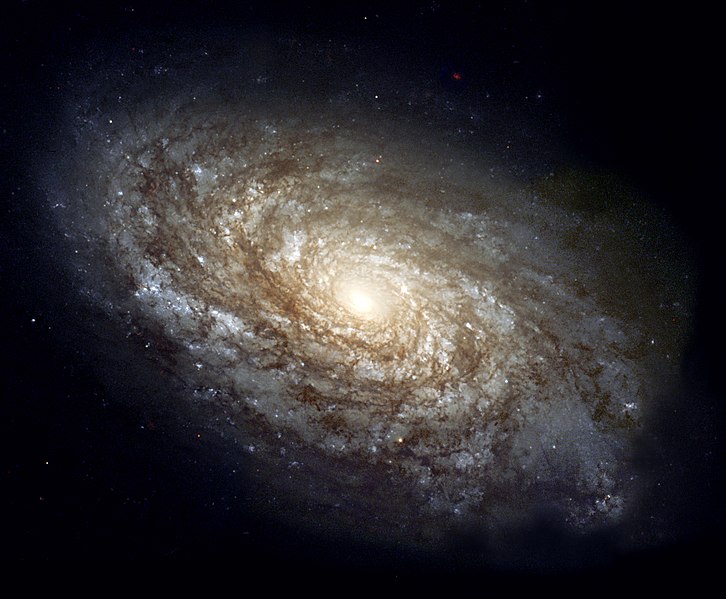 NGC 4414, спиральная галактика из созвездия Волосы Вероники, диаметром около 17 кило­парсек, расположенная на расстоянии около 20 мега­парсек от Земли